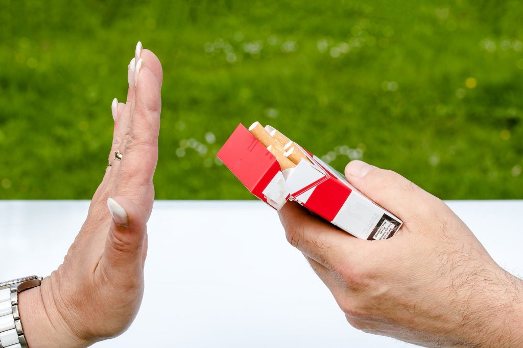 An ex-smoker from Wrexham refuses a cigarette after successfully giving up smoking in North Wales